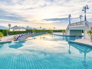 Indoor pool, outdoor pool, free pool cabanas, pool umbrellas