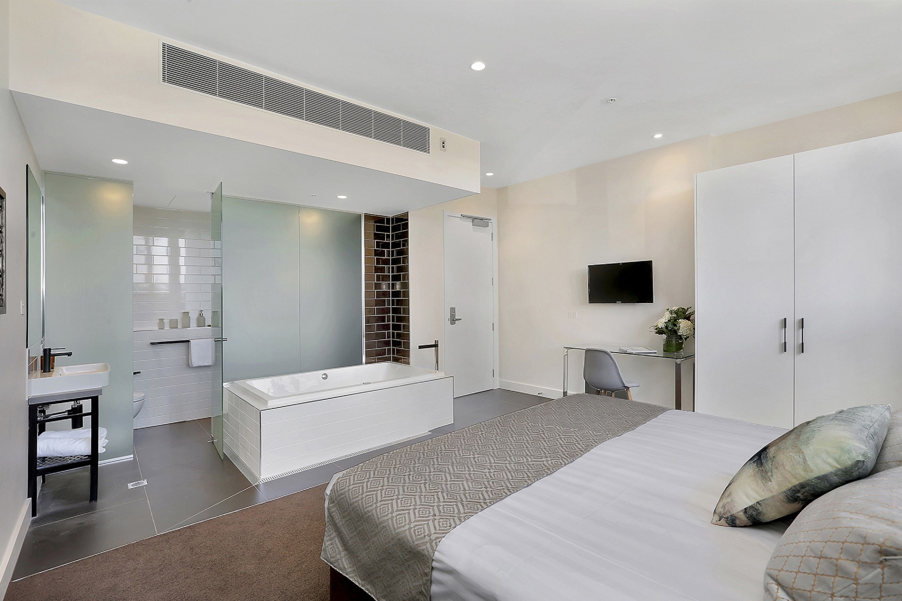 executive king spa room | in-room safe, desk, soundproofing, iron/ironing board