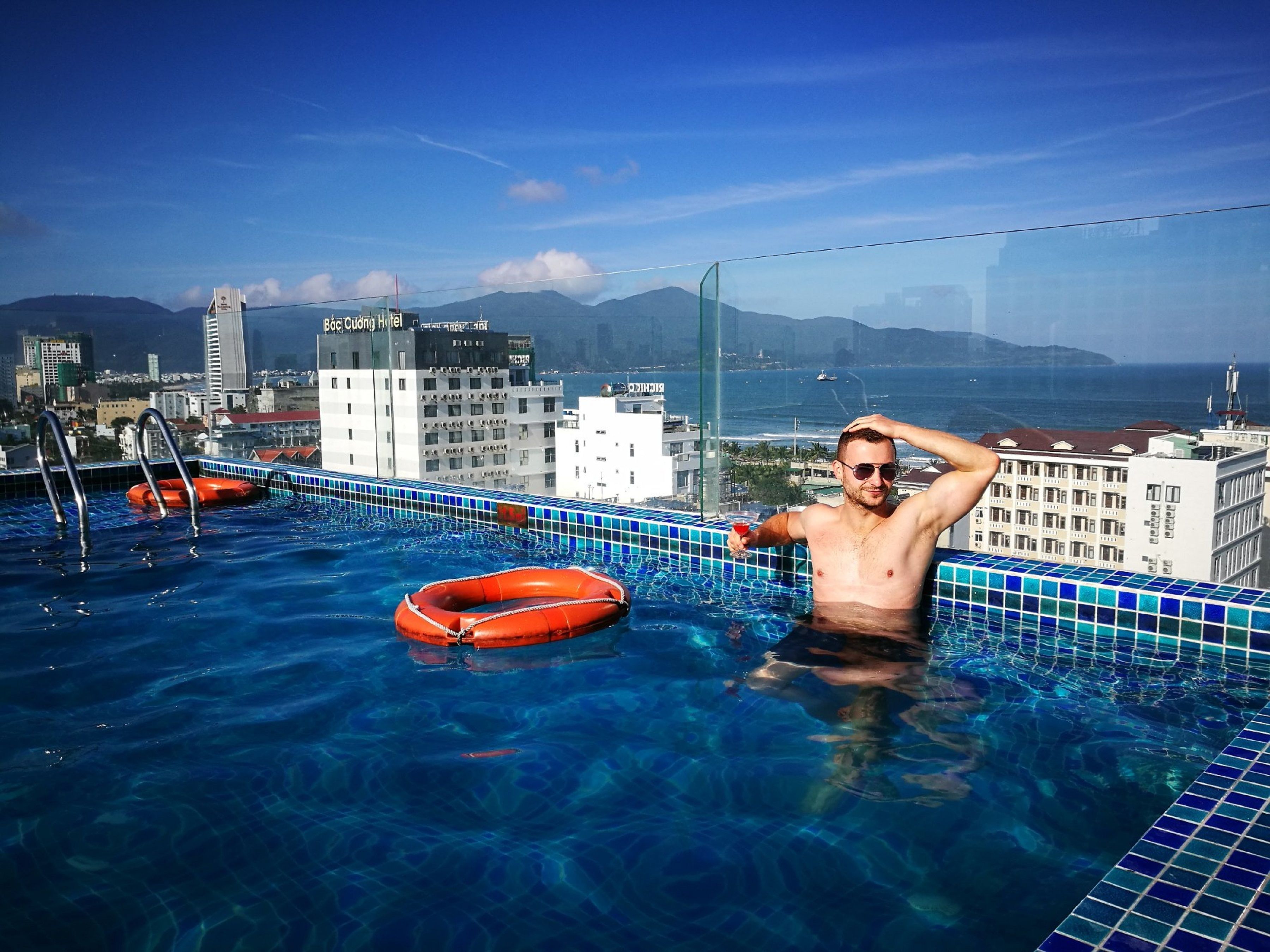 outdoor pool, open 8 am to 9 pm, pool umbrellas