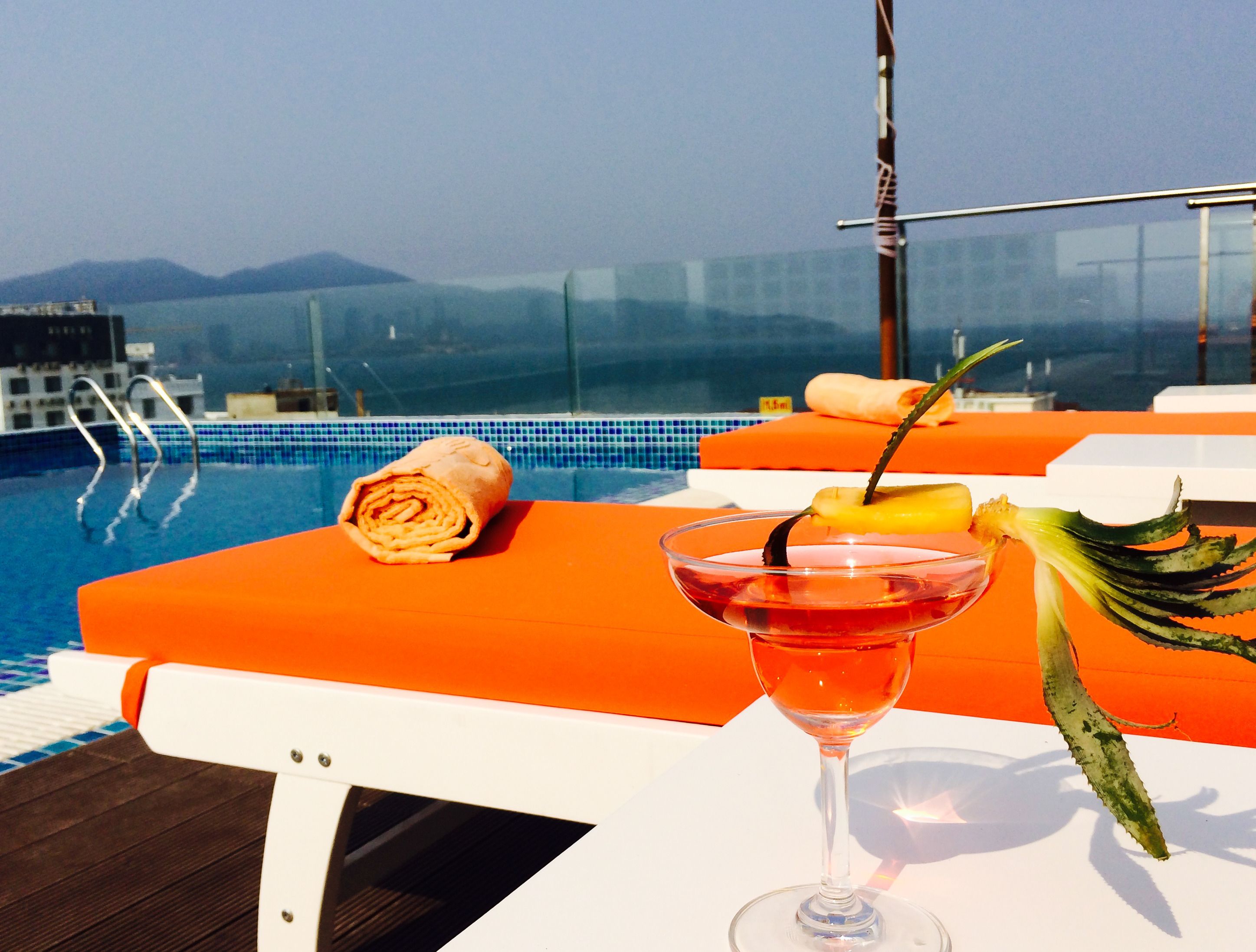 outdoor pool, open 8 am to 9 pm, pool umbrellas