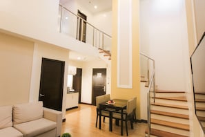 Loft, 2 Bedrooms | Living area | 32-inch flat-screen TV with cable channels, TV - Prime City Resort Hotel (Angeles City)