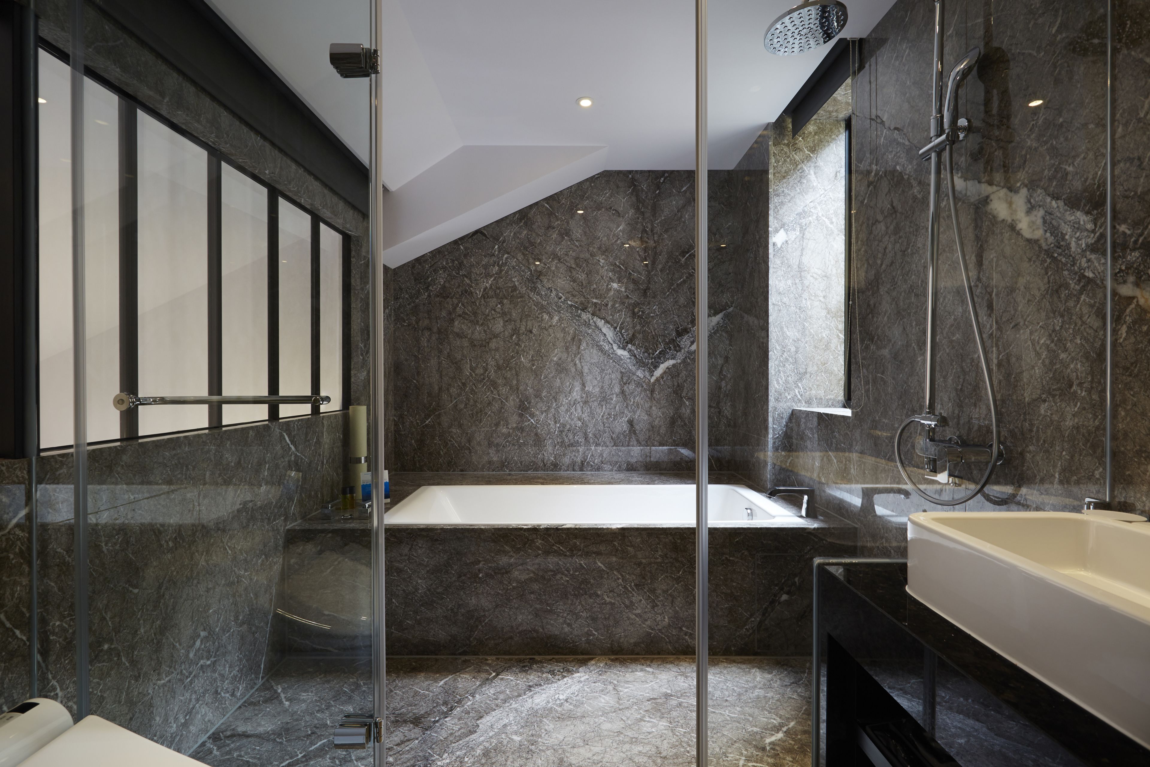 luxury loft, balcony, city view (penthouse) | bathroom | eco-friendly toiletries, hair dryer, slippers, towels