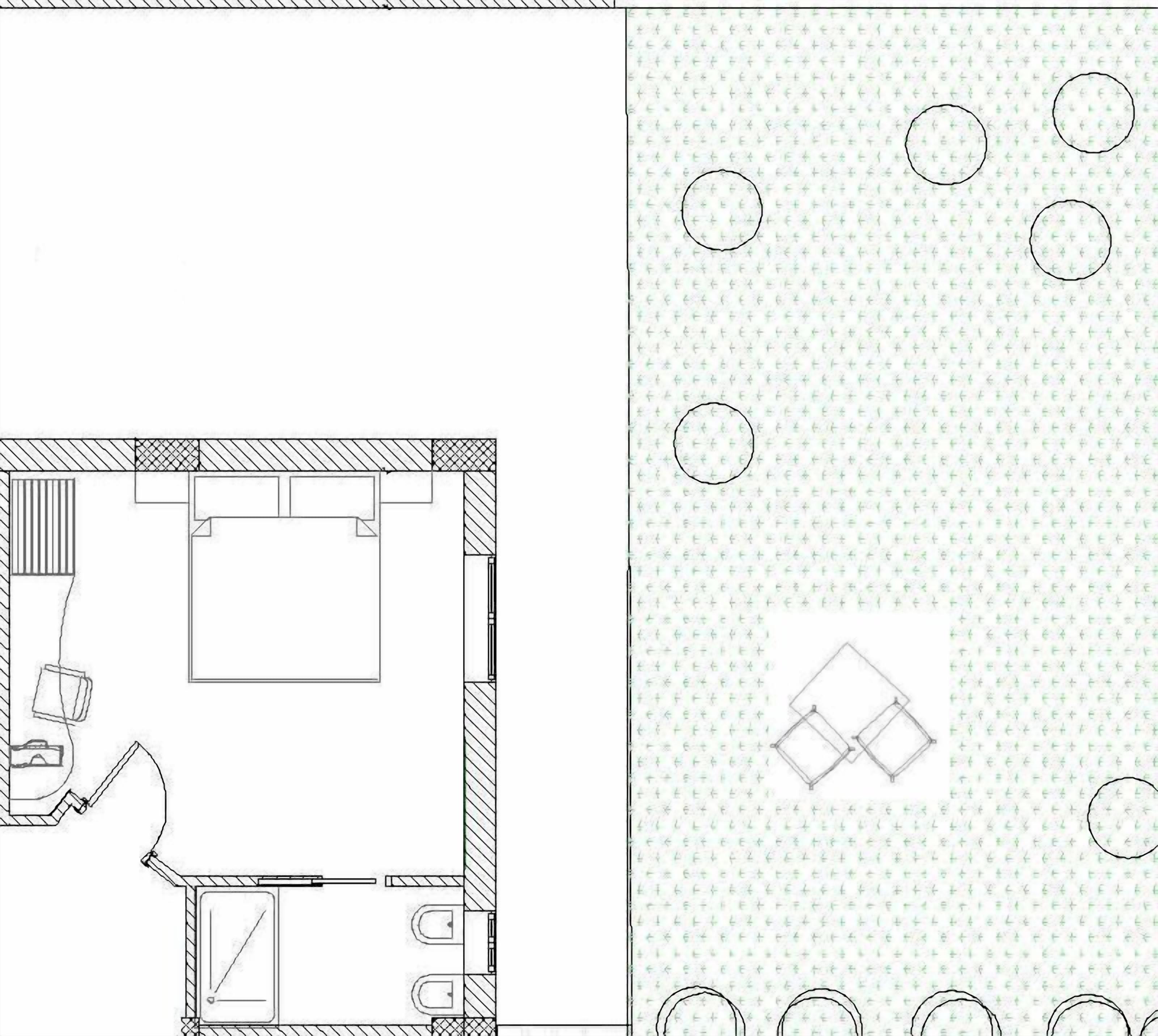 A floor plan with a bathroom, a kitchen, and a living area.