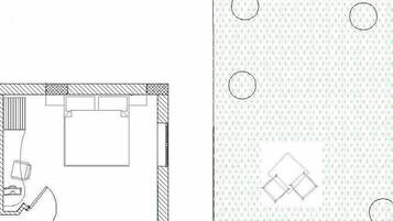 A floor plan with a bathroom, a kitchen, and a living area.