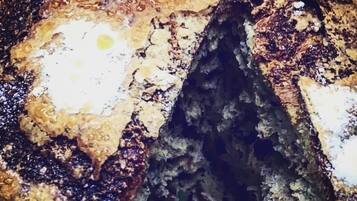 A close-up of a textured surface with a central void.