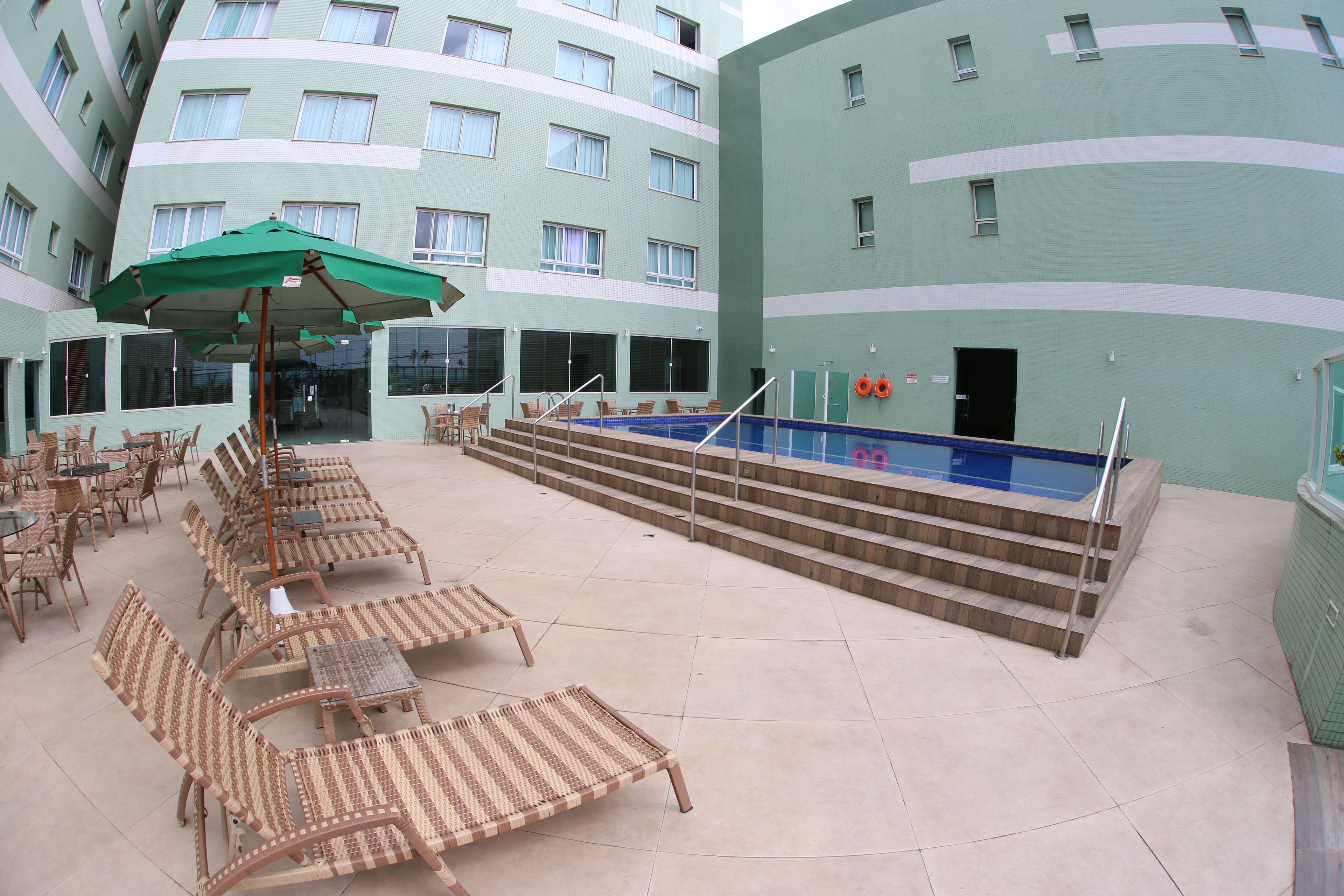 outdoor pool, open 10:00 am to 8:00 pm, pool umbrellas, pool loungers