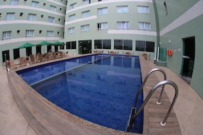Outdoor pool, open 10:00 AM to 8:00 PM, pool umbrellas, pool loungers