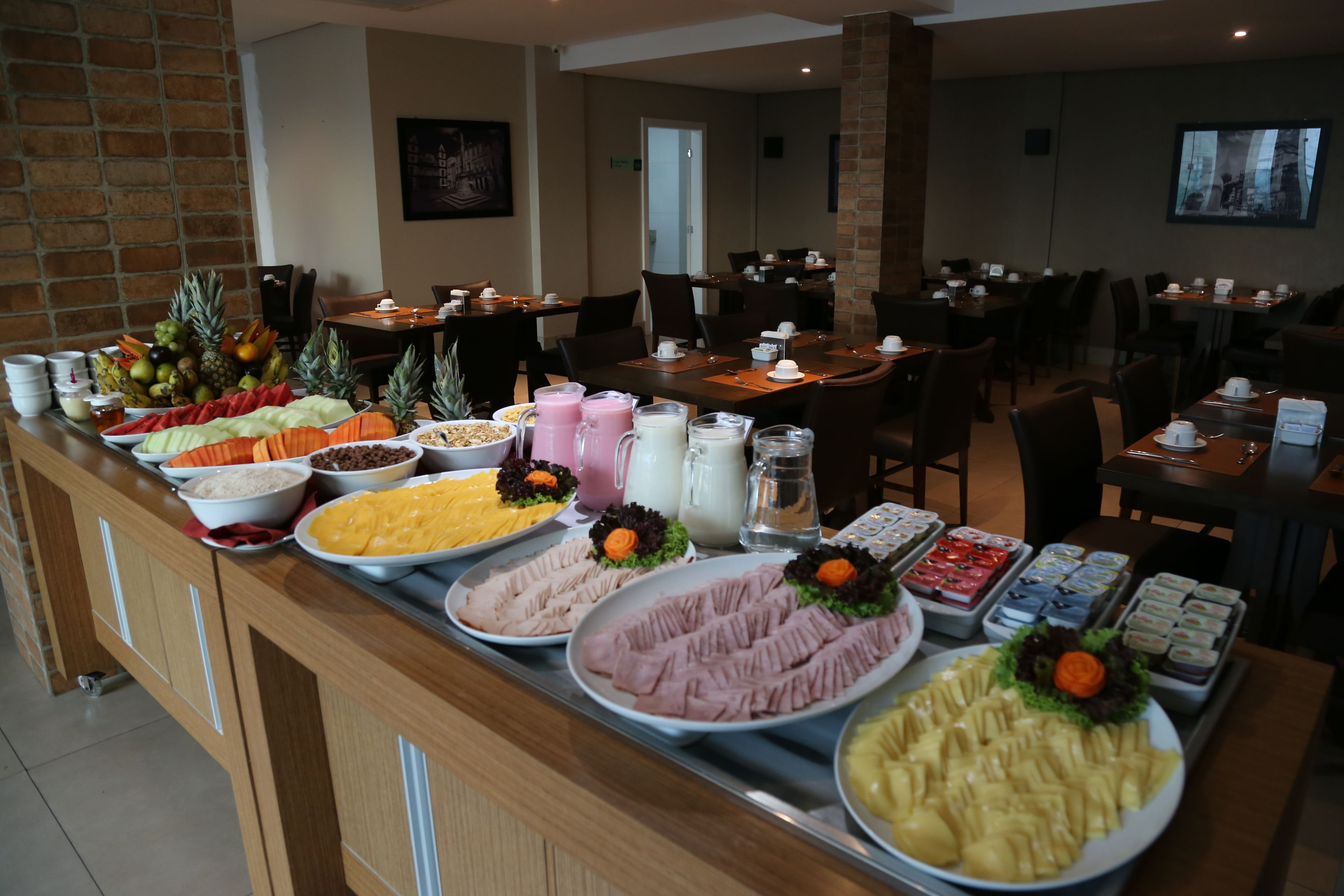 A buffet with various food items and beverages.