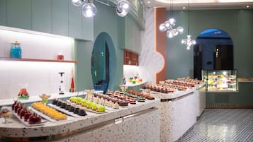 A buffet with various desserts and snacks.