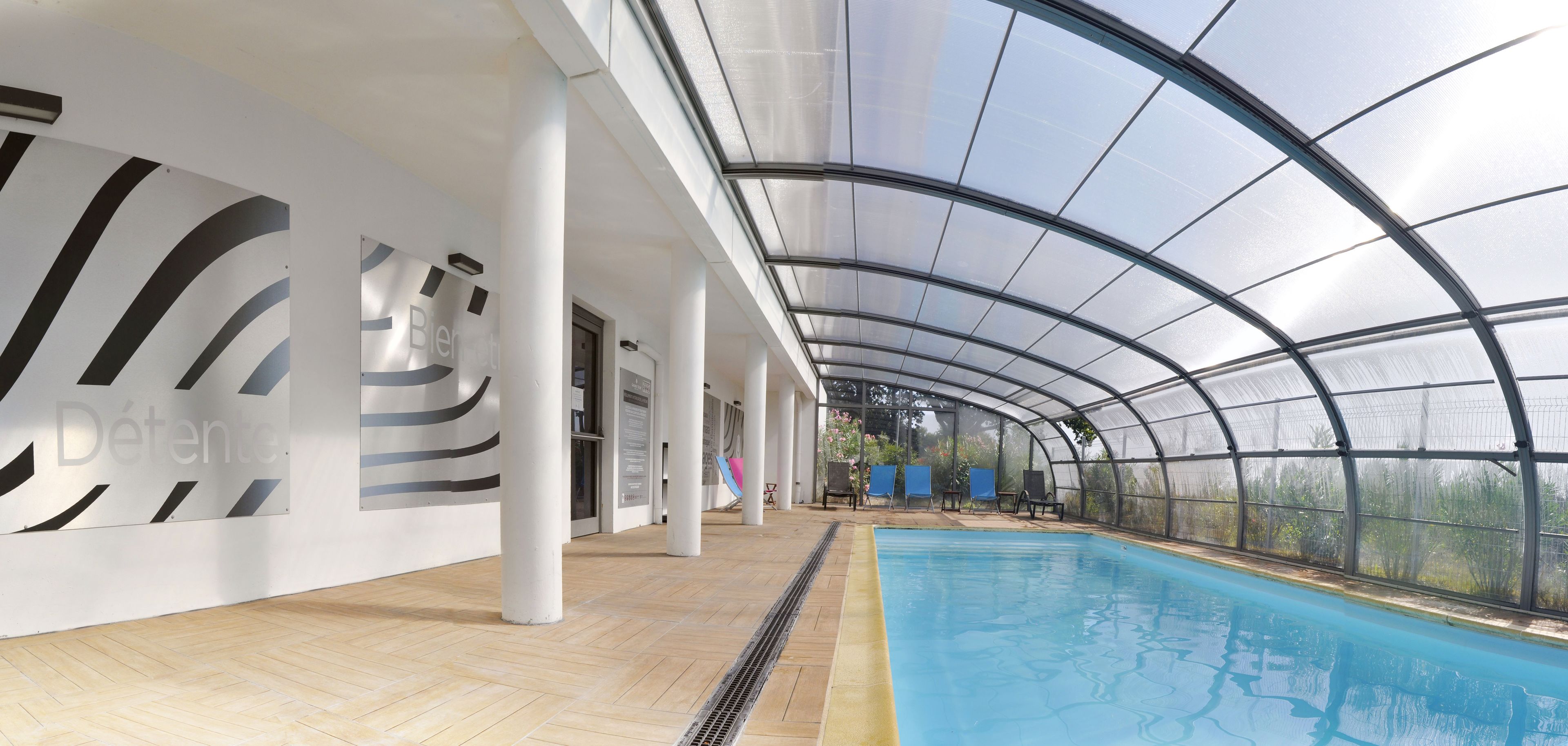 indoor pool, open 8:00 am to 10:00 pm, pool loungers