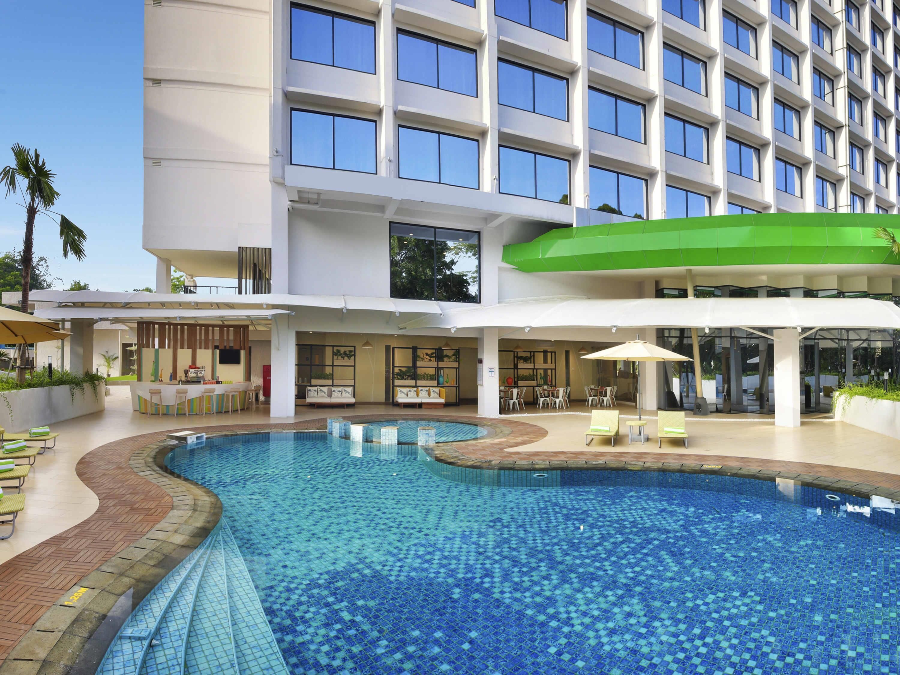 Outdoor pool, open 6:00 AM to 6:00 PM, pool loungers