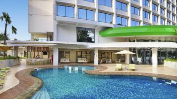 Outdoor pool, open 6:00 AM to 6:00 PM, pool loungers