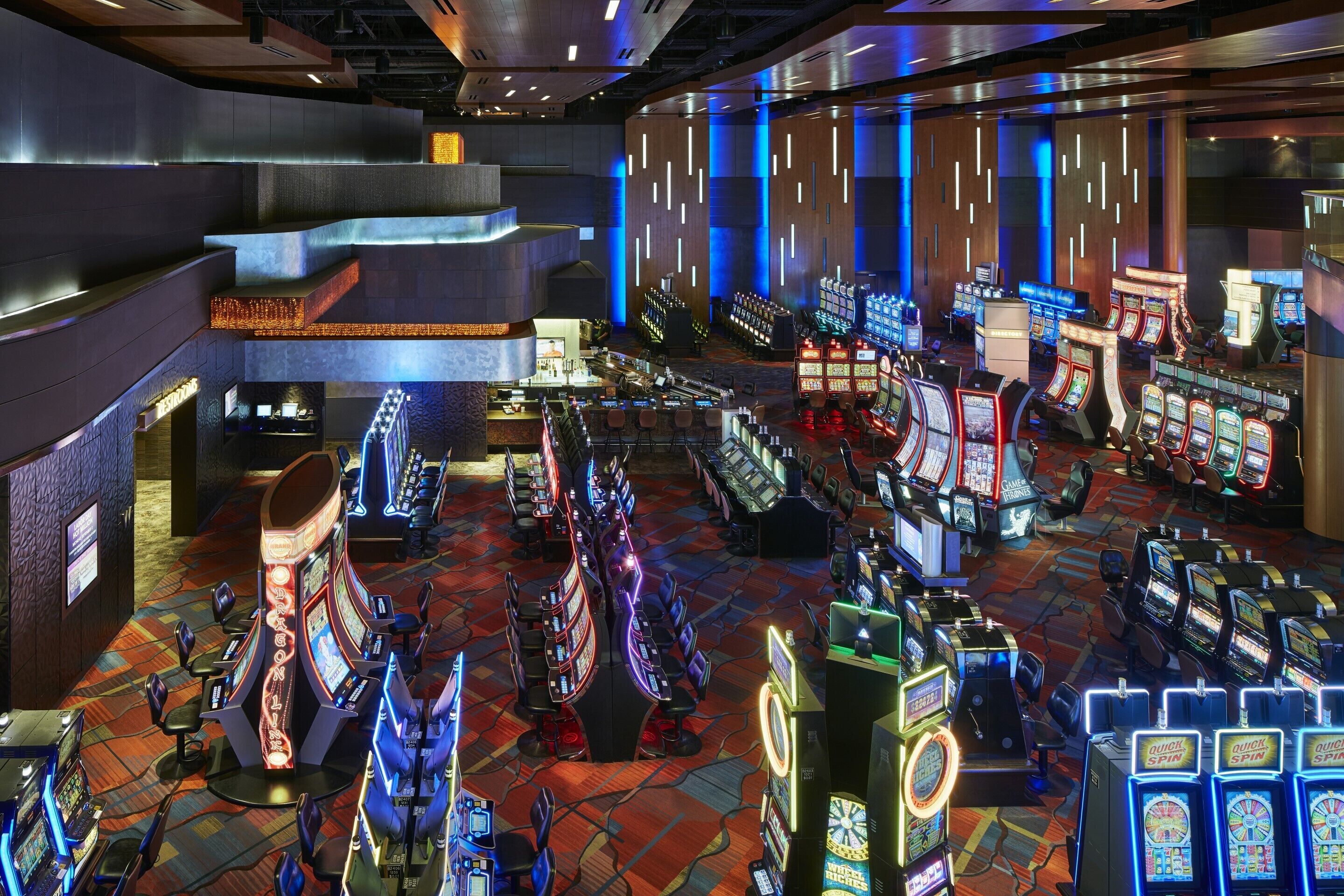 A casino with multiple gaming tables and slot machines.