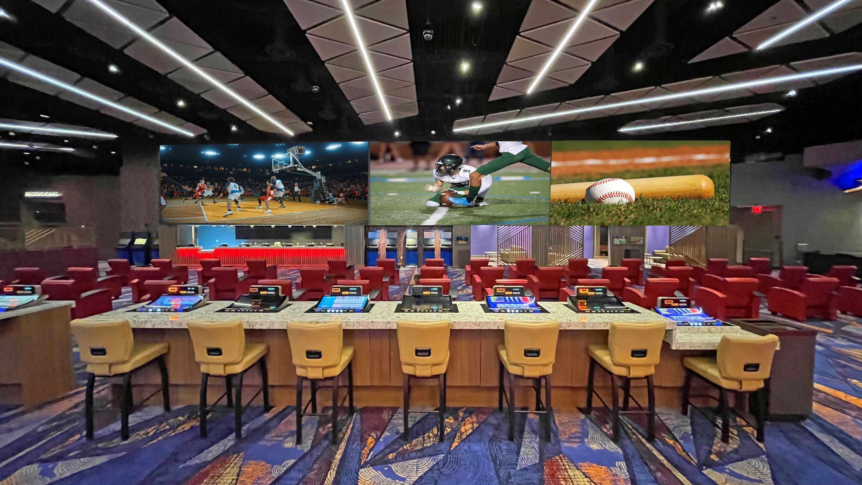 A conference room with multiple screens displaying sports events, red chairs, and a marble table.