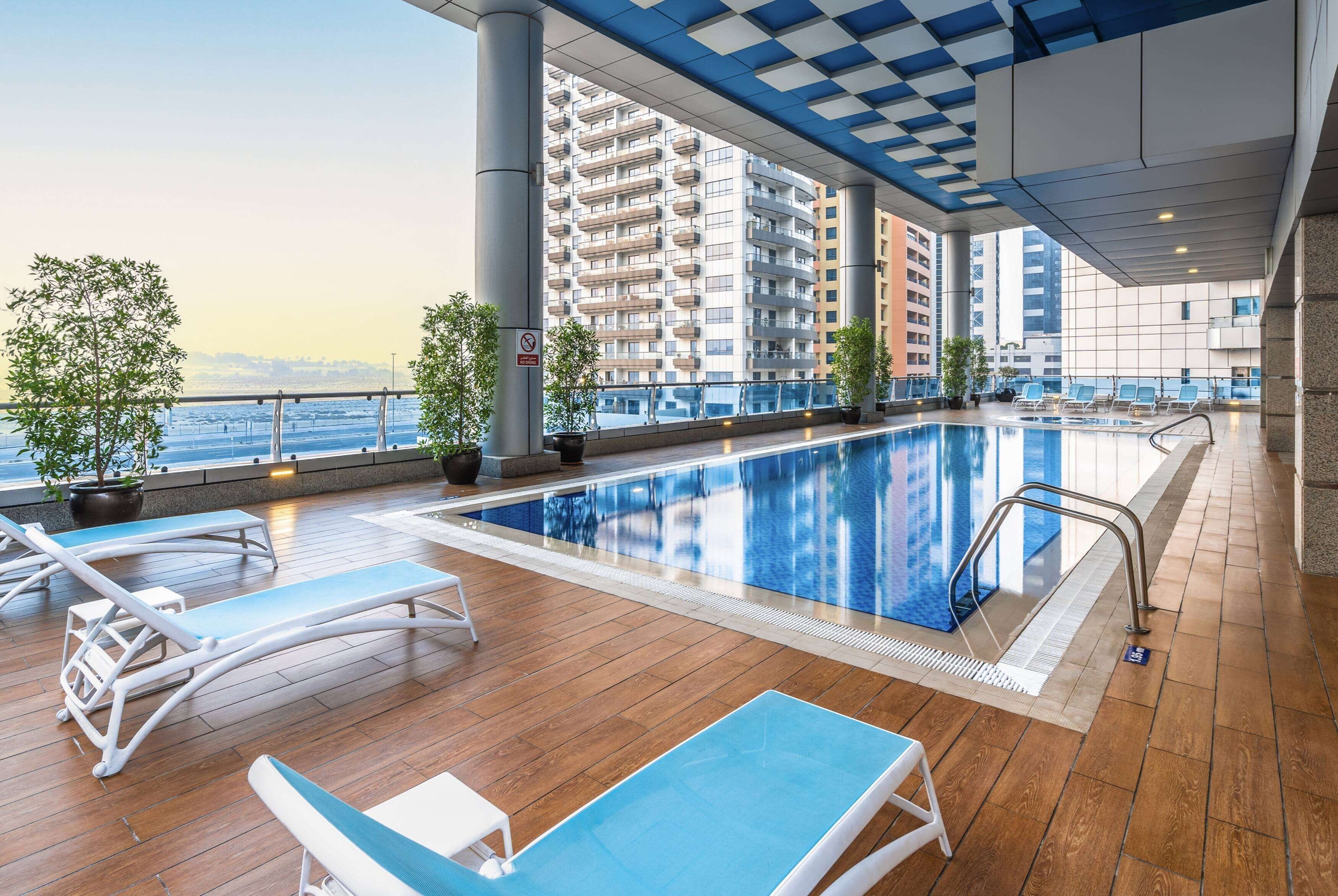 2 outdoor pools, open 9 am to 6 pm, pool loungers, lifeguards on site