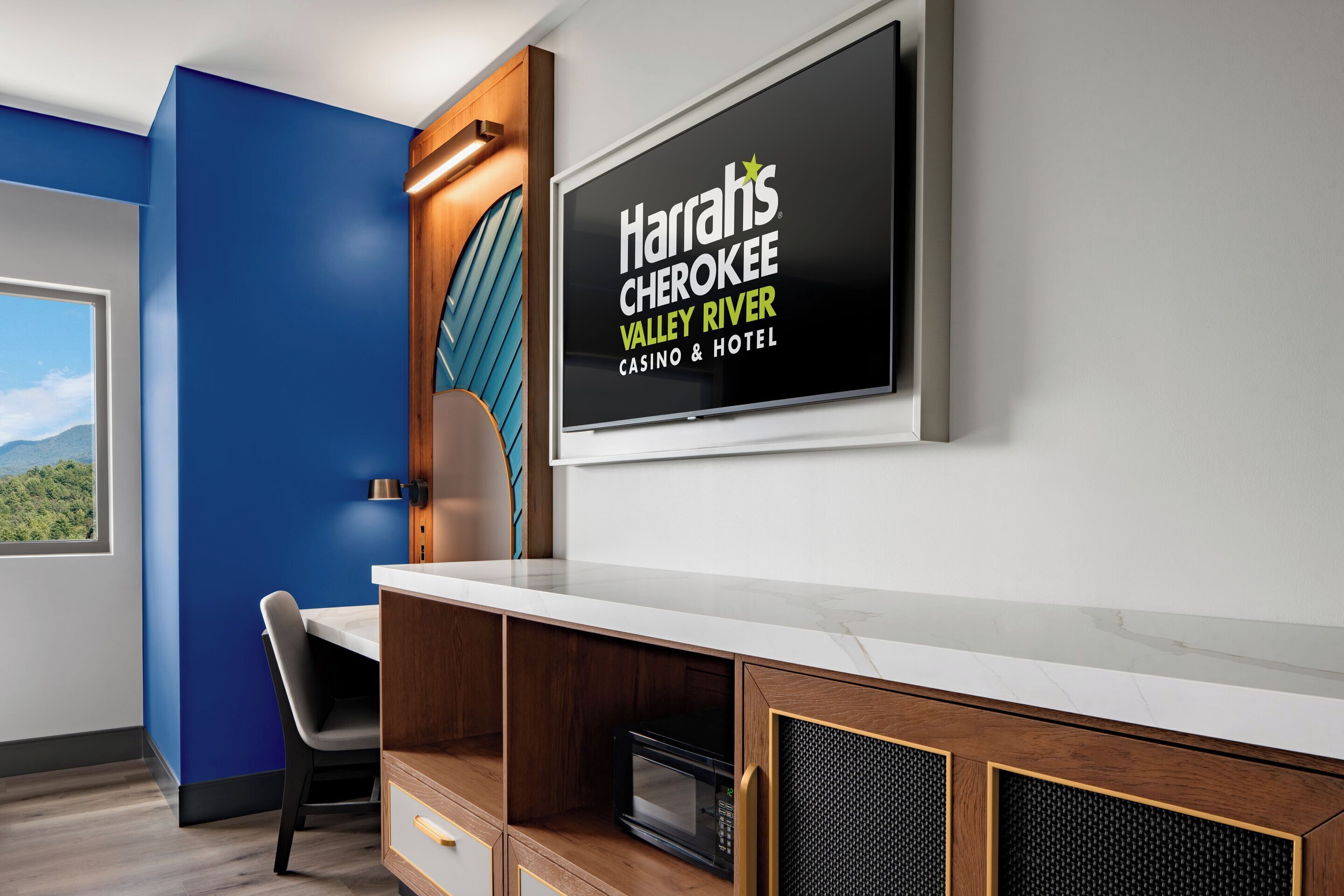 A hotel reception desk with a sign for 'Harr's Cherokee Valley River Casino & Hotel.'