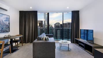 Executive One Bedroom Apartment | Living area | 48-inch Smart TV with premium channels, TV, Netflix