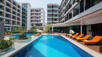 Outdoor pool, pool umbrellas, sun loungers