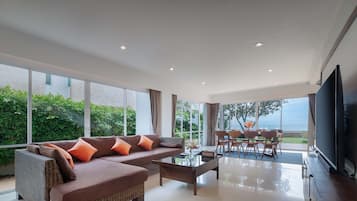 4 Bedrooms Beachfront Villa | Living area | 65-inch flat-screen TV with cable channels, TV, Netflix