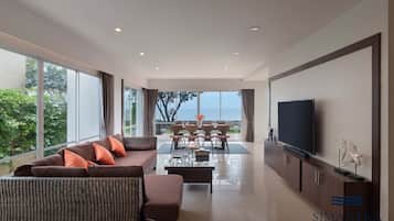 4 Bedrooms Beachfront Villa | Living area | 65-inch flat-screen TV with cable channels, TV, Netflix