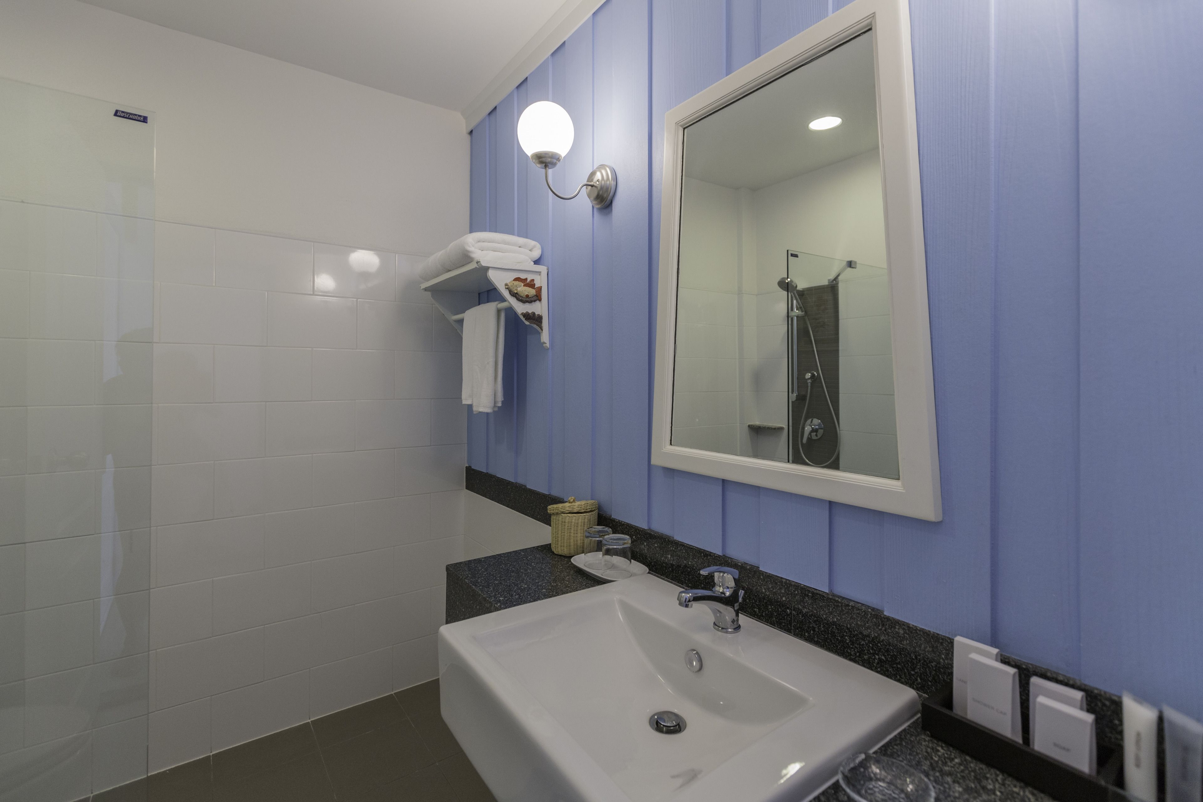 deluxe room | bathroom | shower, free toiletries, slippers, towels