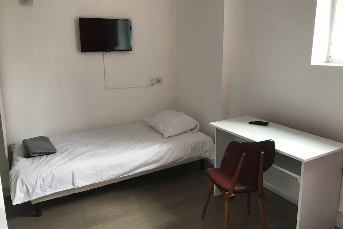 Premium bedding, desk, blackout curtains, soundproofing