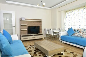 Departamento, vista al jardín | Sala de estar | Televisión LCD