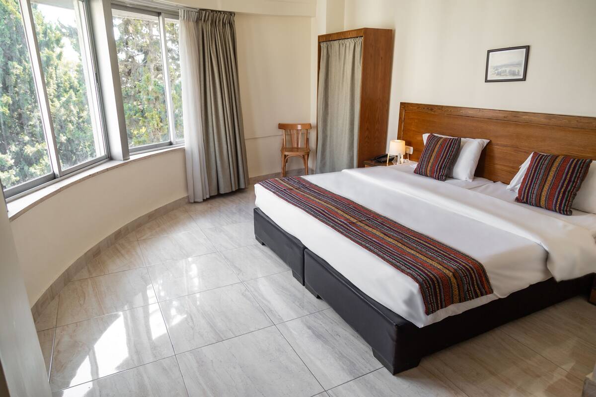 Deluxe Suite, City View | Minibar, in-room safe, desk, laptop workspace
