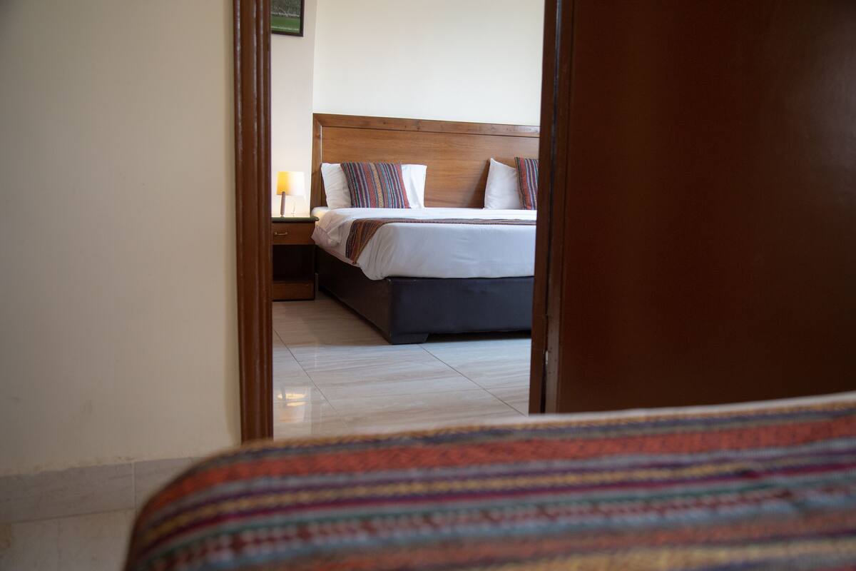 Standard Quadruple Room, 2 Bedrooms, City View | Minibar, in-room safe, desk, laptop workspace