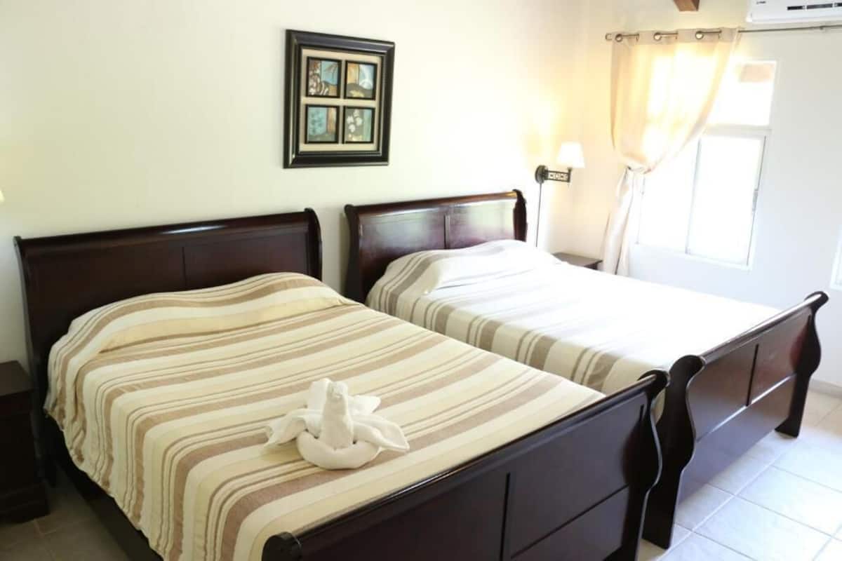 1 bedroom, pillow-top beds, individually decorated, desk