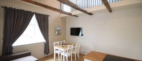 Deluxe Apartment (Loft Bed) | Living room | 32-inch flat-screen TV with cable channels, LCD TV