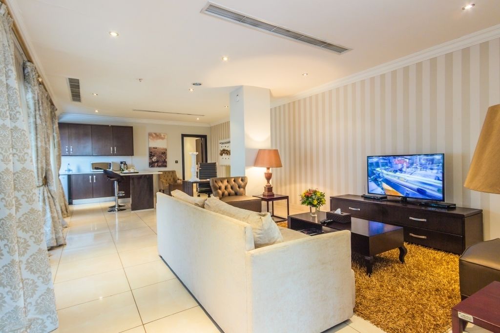 Presidential Penthouse, Kitchenette | Living area | 50-inch Smart TV with cable channels