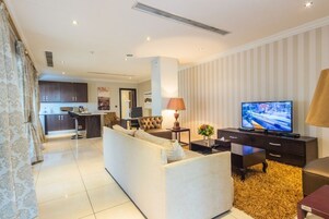 Presidential Penthouse, Kitchenette | Living area | 50-inch Smart TV with cable channels