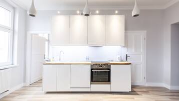 Premier Apartment, 1 Bedroom, City View | Private kitchenette | Stovetop, dishwasher, coffee/tea maker, cookware/dishes/utensils