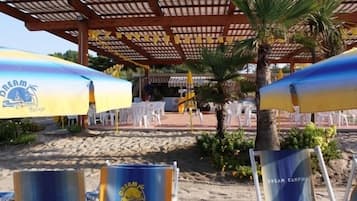 Private beach, sun loungers, beach umbrellas, beach volleyball