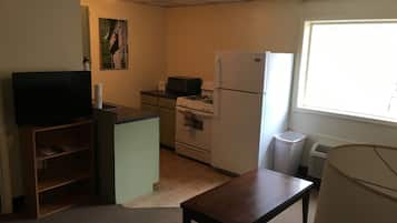 Standard Suite, 1 Bedroom | Living area | 32-inch LCD TV with cable channels, TV