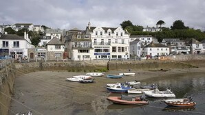A coastal town with a prominent white building labeled 'Ship & Castle Hotel'.