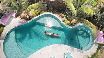 Outdoor pool, open 6:00 AM to 10:00 PM, pool loungers