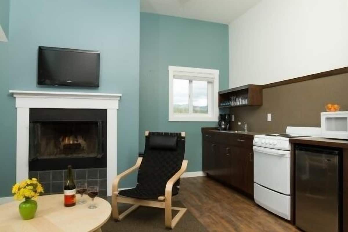 suite, 1 king bed with sofa bed, balcony, partial ocean view | living area | 32-inch flat-screen tv with cable channels, tv, dvd player