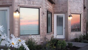 A modern house with large windows and a well-maintained garden. - Land's End at Cannon Beach (Cannon Beach)