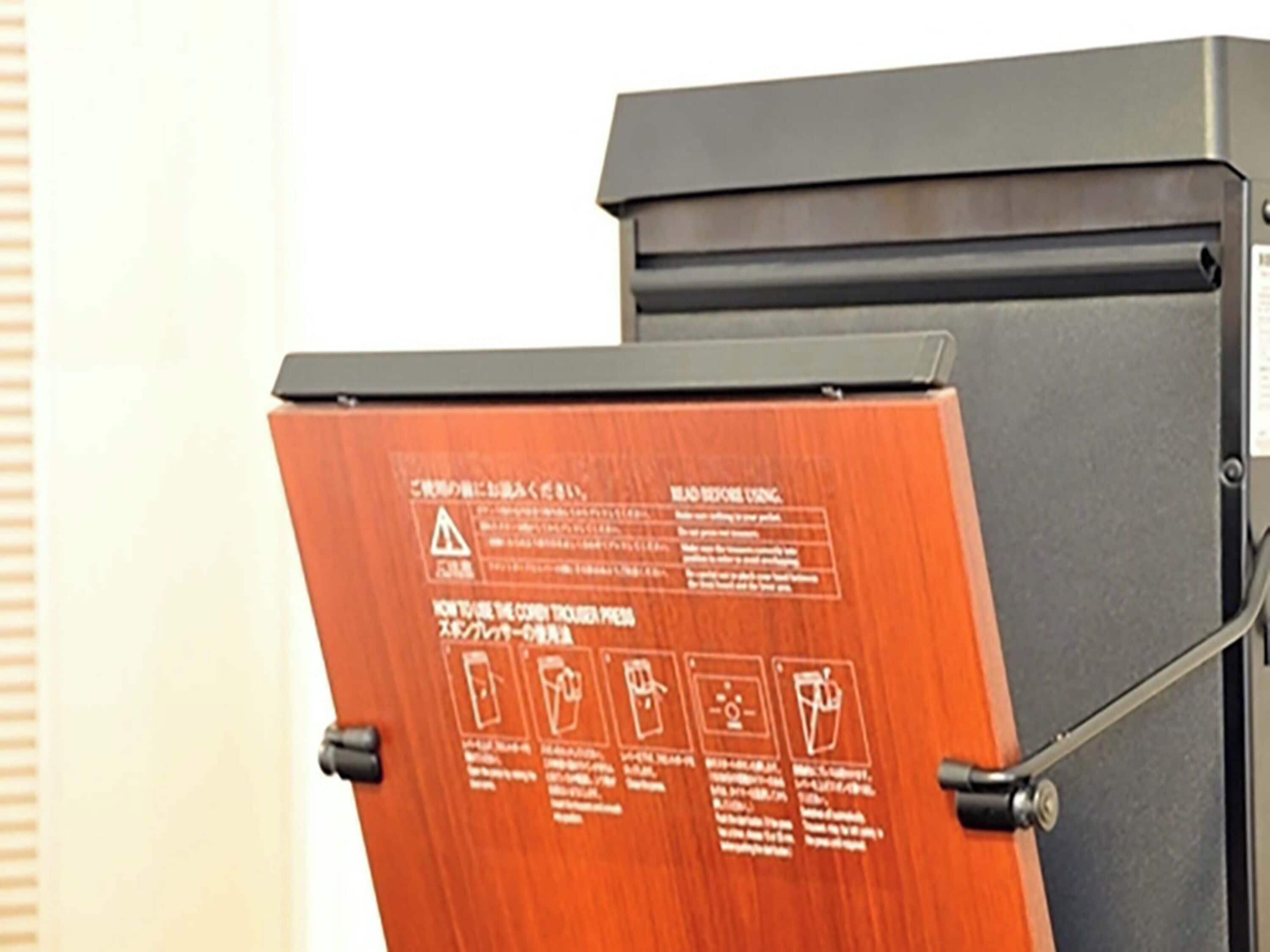 A wooden door with safety instructions and symbols.