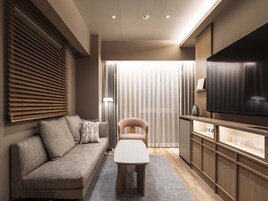 Down comforters, desk, blackout drapes, iron/ironing board