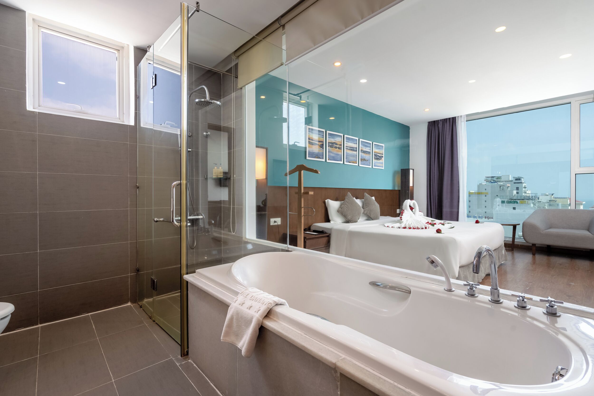 suite room - sea view or city view | bathroom | designer toiletries, hair dryer, slippers, towels