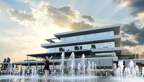 A modern building with multiple levels and a water fountain in front. - Atakoy Marina Park Hotel Residences (Istanbul)