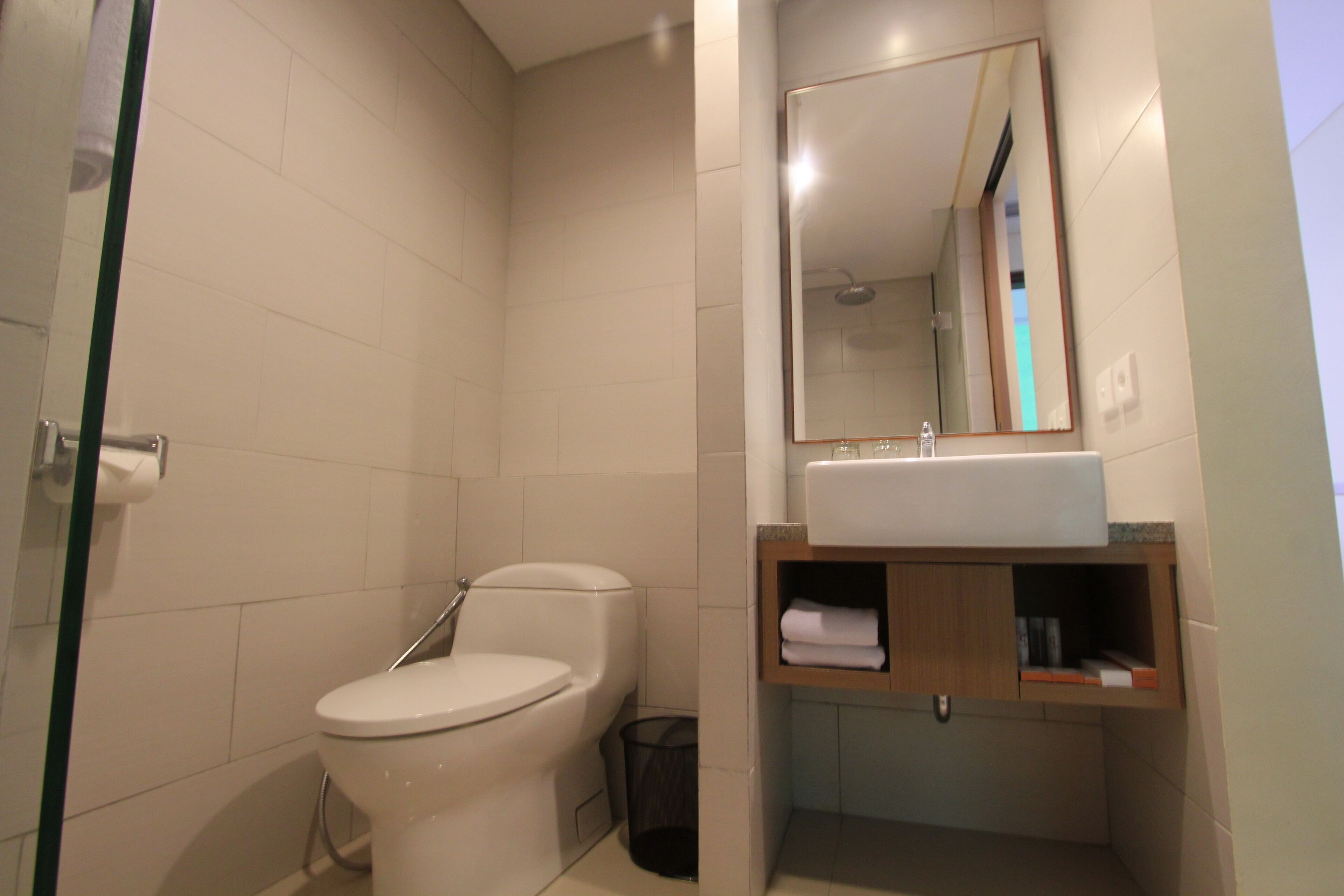 deluxe upper floor room, double bed with pool view | bathroom | free toiletries, hair dryer, bidet, towels