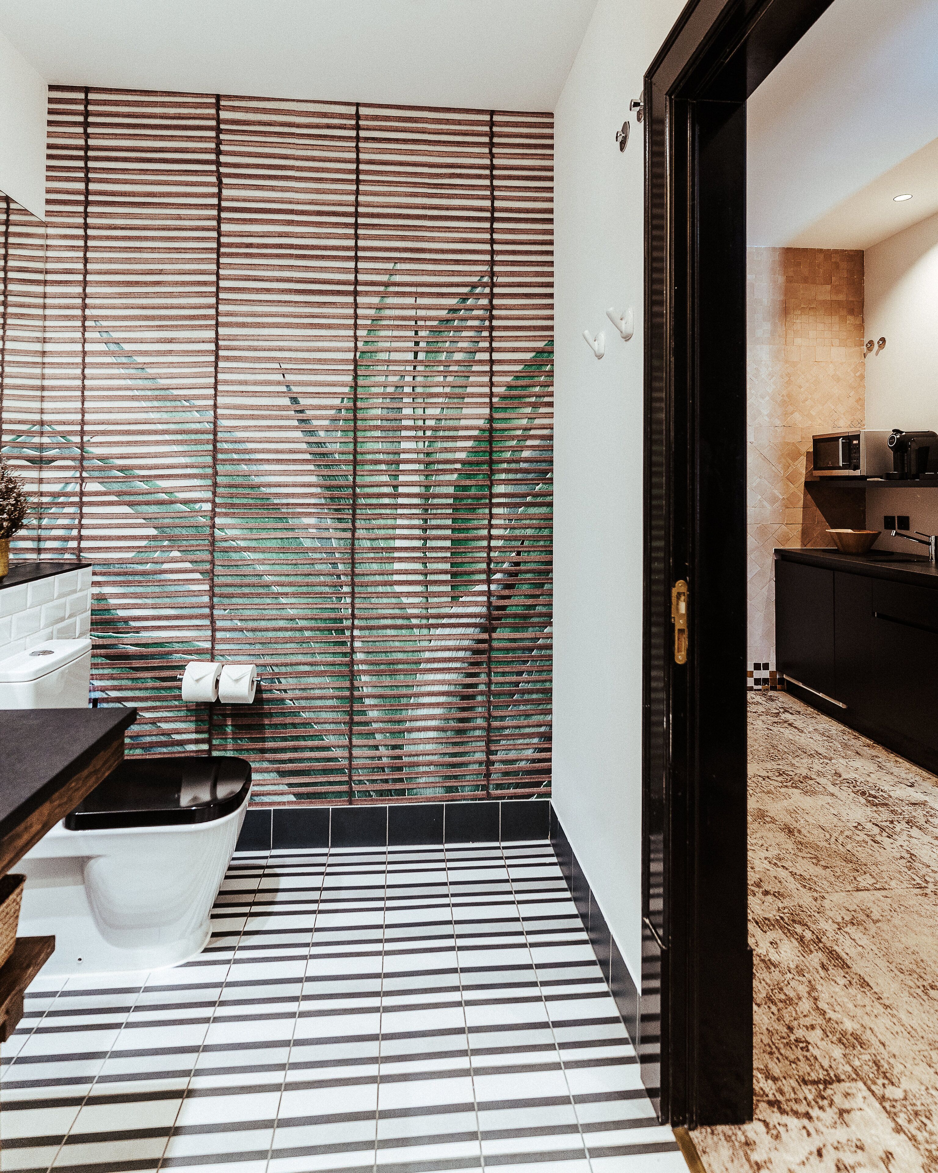 deluxe suite (square view) | bathroom | shower, designer toiletries, hair dryer, slippers