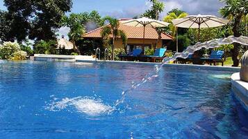 Deluxe Villa | Pool | 2 outdoor pools, pool loungers