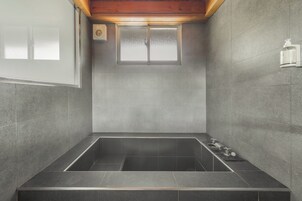 Standard Chalet | Bathroom | Hair dryer, slippers, towels, shampoo