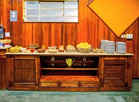 A buffet setup with various food items and serving dishes.
