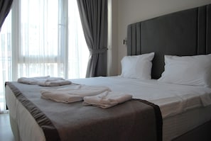 Luxe beddengoed, een minibar, een kluis op de kamer, geluiddichte muren